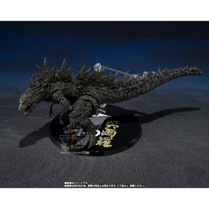 Action figure articolata S.H.MonsterArts di Godzilla 2023 nella forma di Odo Island Monster da Godzilla Minus One, con pelle rugosa marrone, fauci aperte e piccoli aculei dorsali